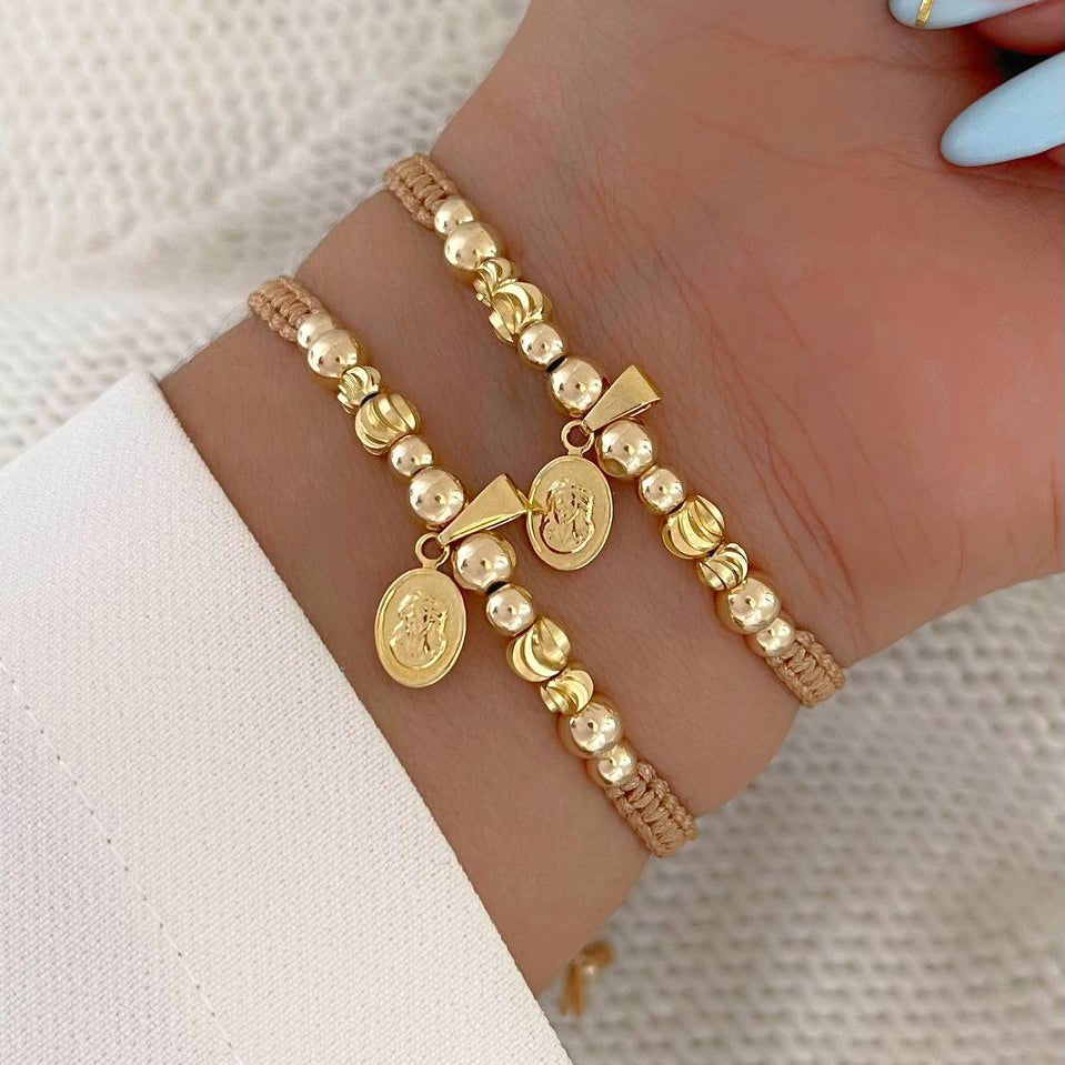 MP115 - Par manillas balines con dije rostro