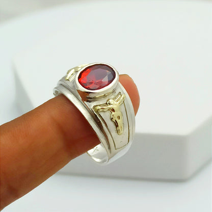 Anillo Cristos Plata y Oro con Circon Rojo Ovalado