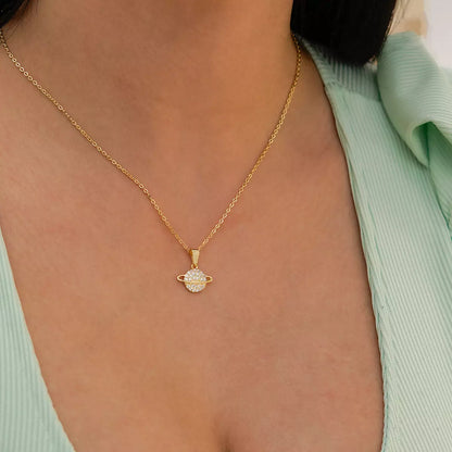 23191 - Dije Saturn Circonias Cristal