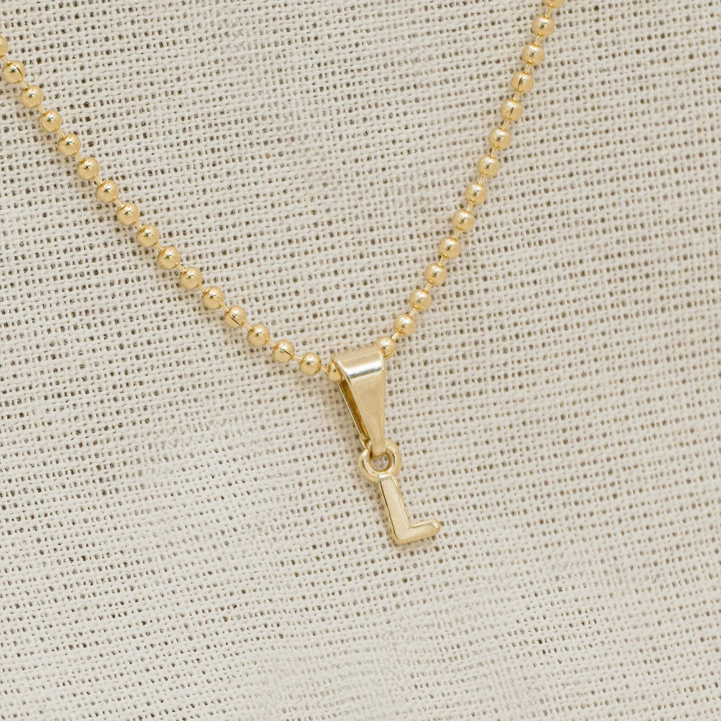 26360L - Dije Silueta Letra L Lisa Mini