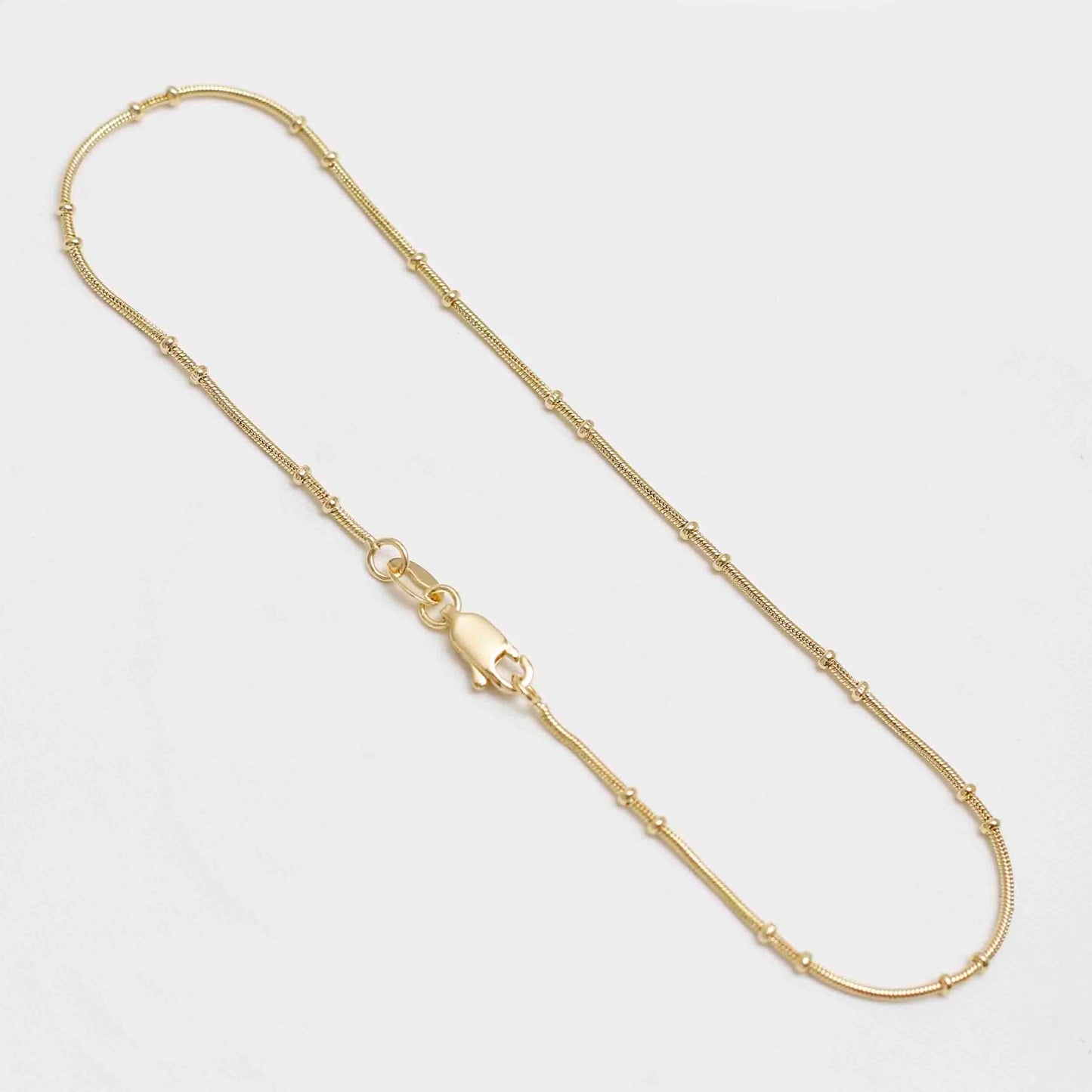 54869 - Tobillera Doble Bola 25Cm